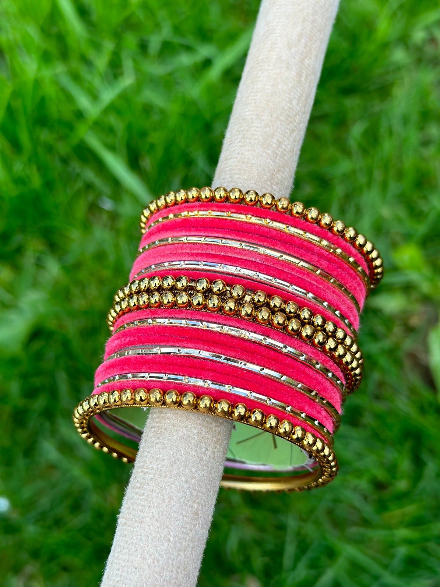 Carrot pink velvet bangles set with golden beaded kangan’s
