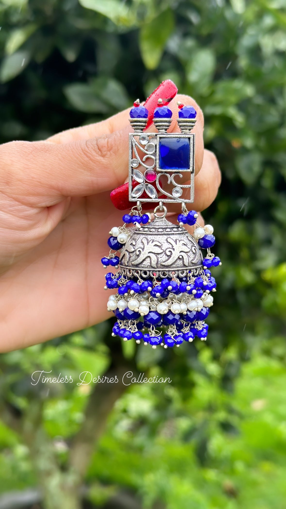Blue Jhumka drop earrings in silver with Monalisa