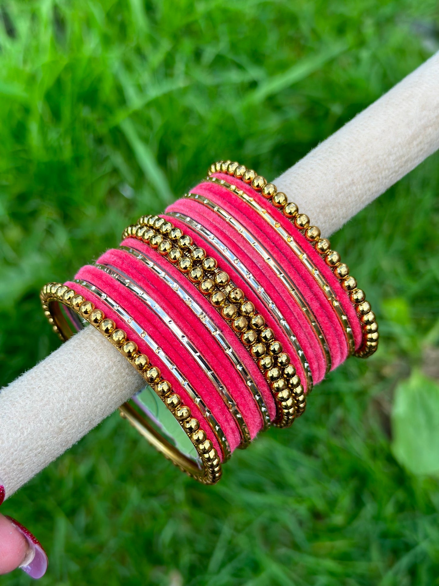 Carrot pink velvet bangles set with golden beaded kangan’s