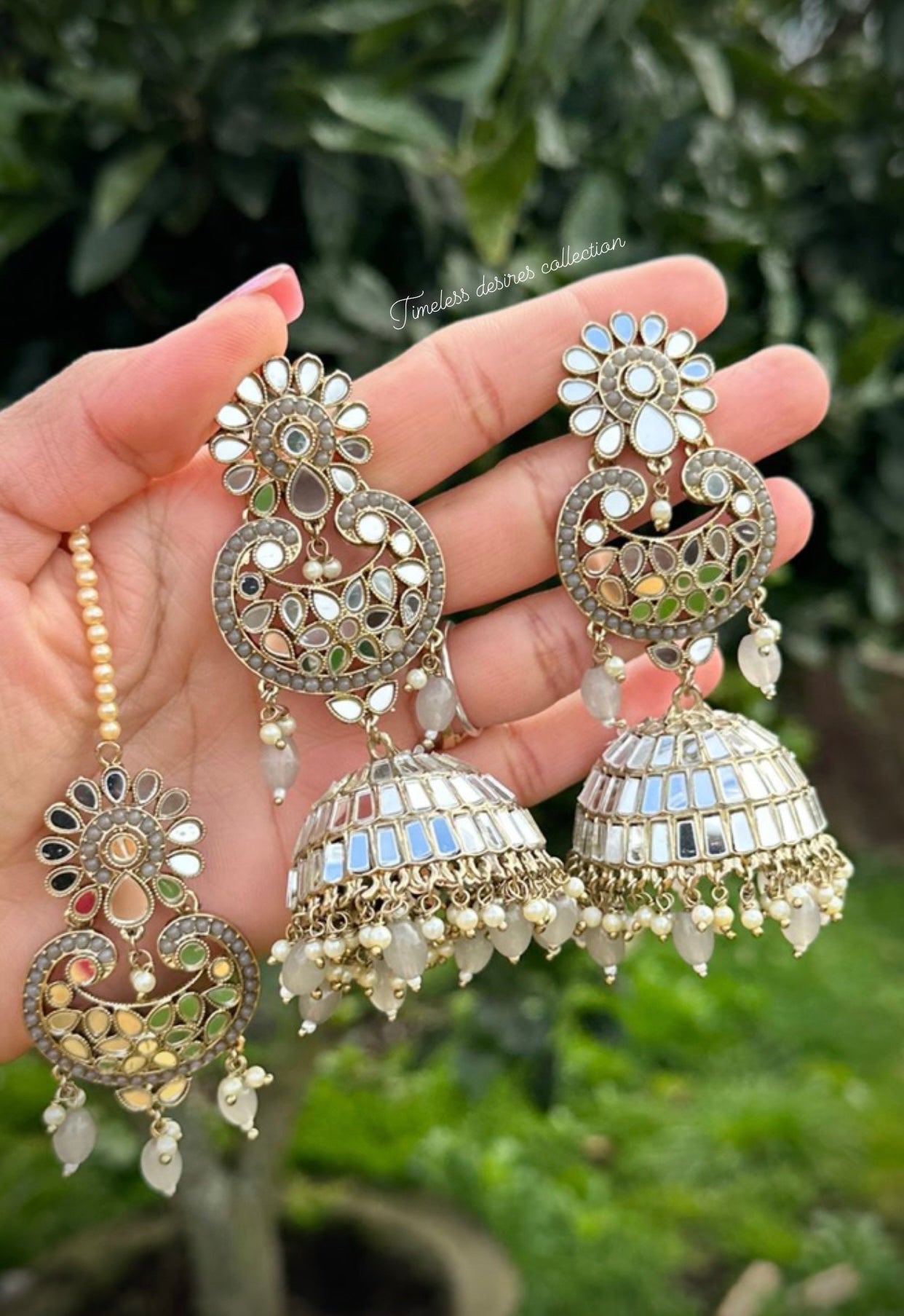 Grey long earnings and tikka set in mirror