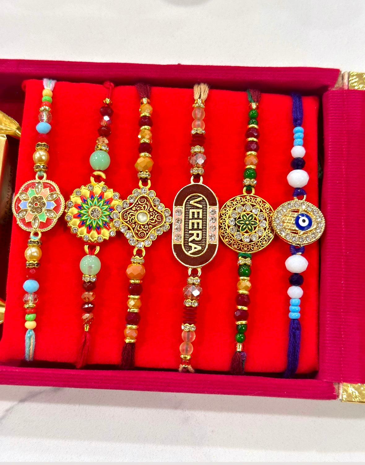 Family Rakhi Hamper bundle with Gifts - 6 Assorted Rakhdi + 6 Key Rings + Chocolates