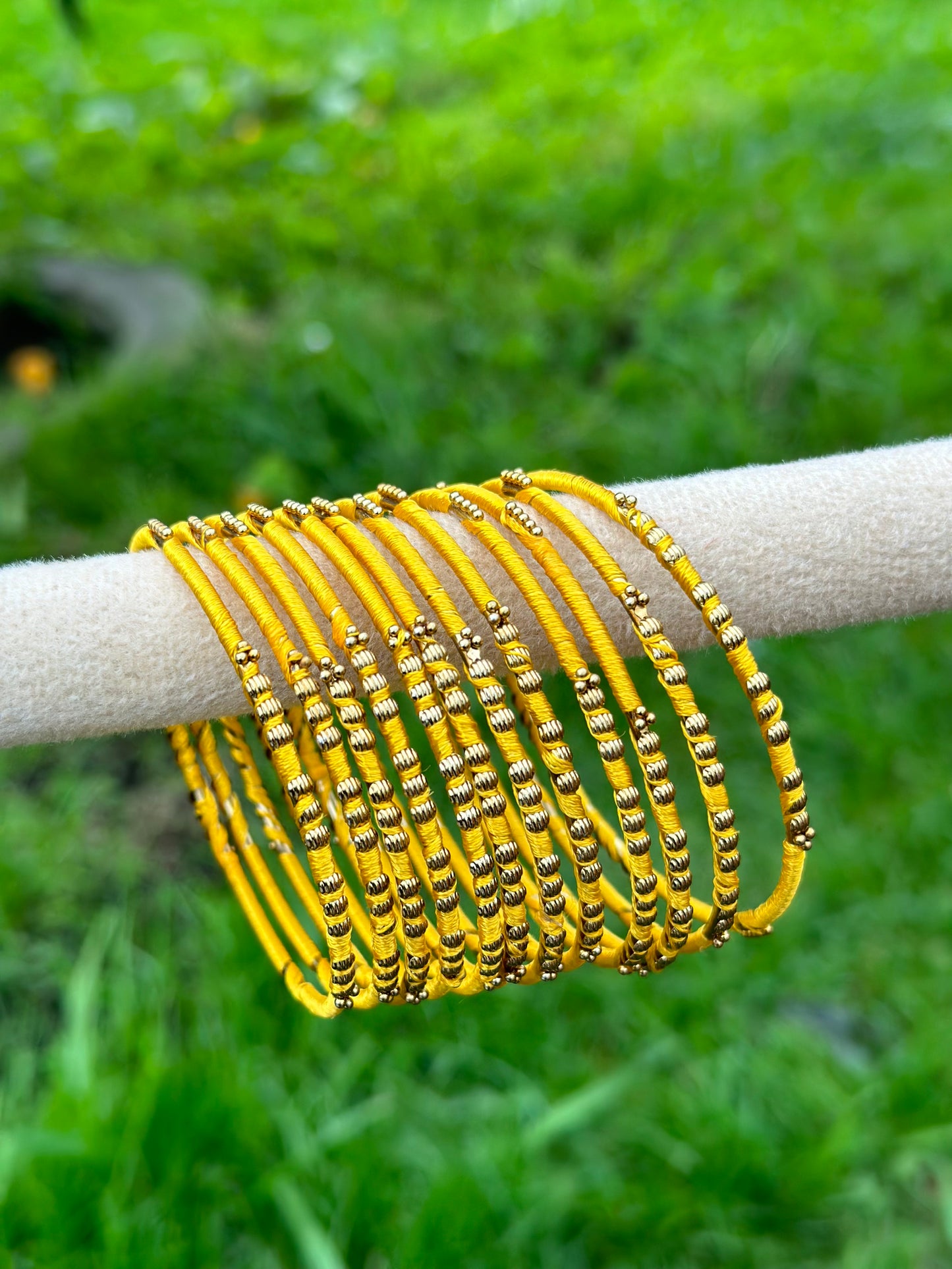 Yellow coloured thread bangles