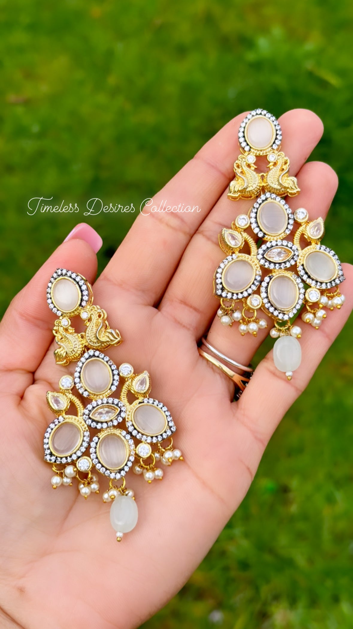 Golden and White statement earrings with Monalisa stones in Gold plating