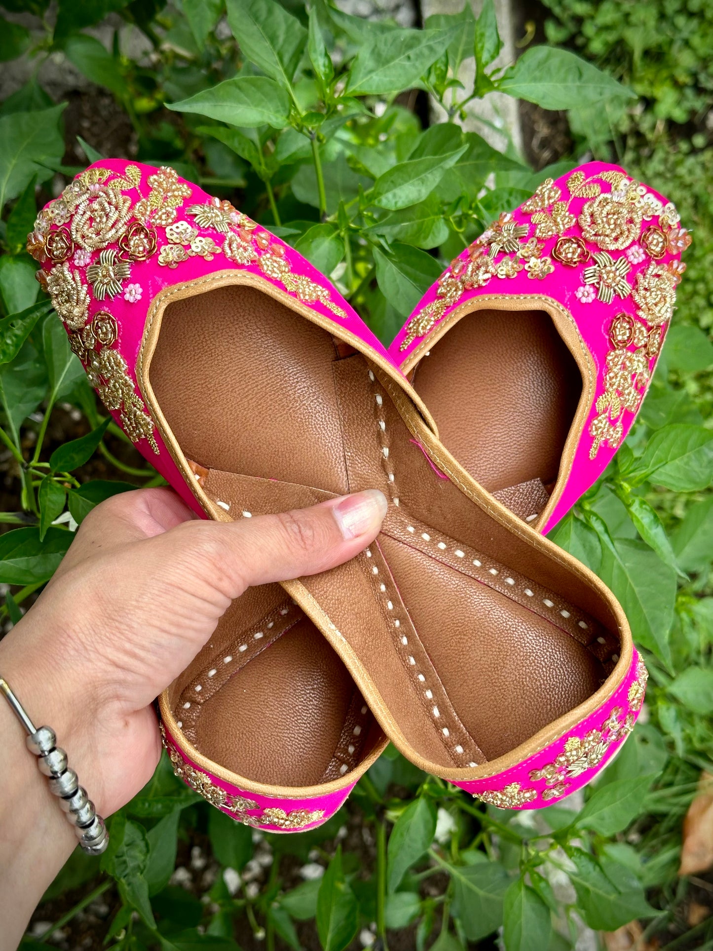 Punjabi jutti in pink colour with golden hand work