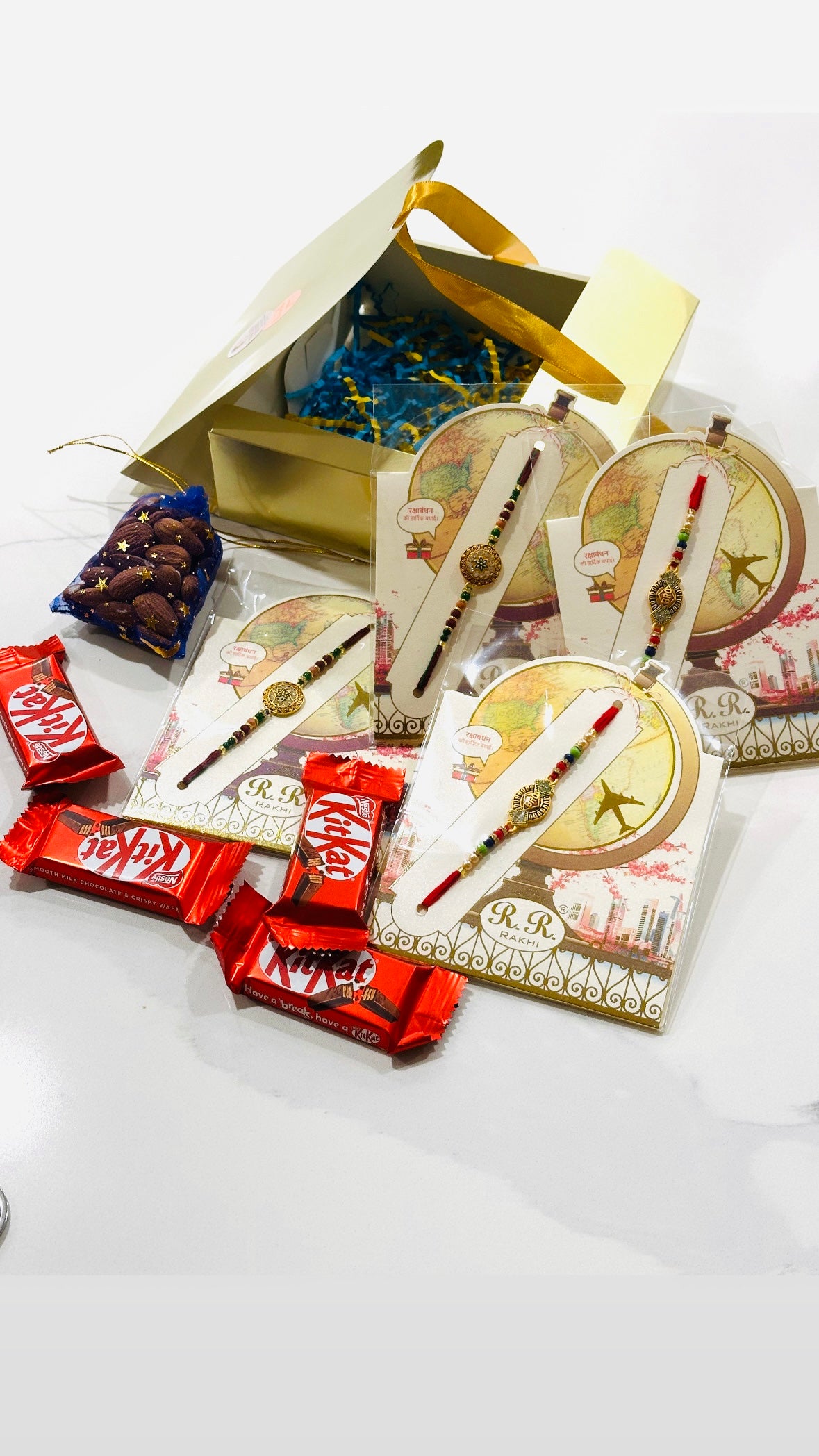 Rakhi / Rakhdi gift hamper box with 4 Rakhi’s and sweets + Dry fruits- ( Assorted designs )