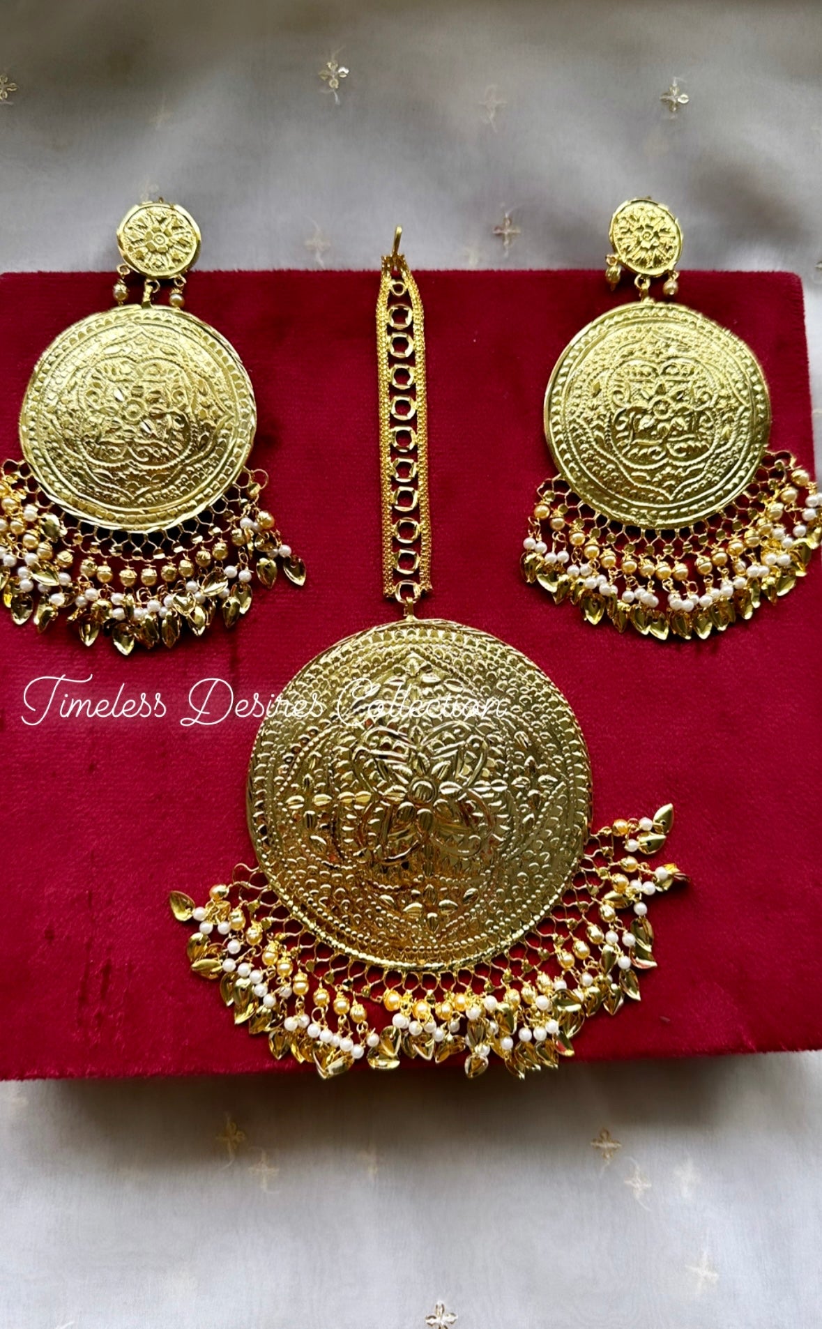 Golden earrings with oversized tikka in Punjabi traditional jewellery