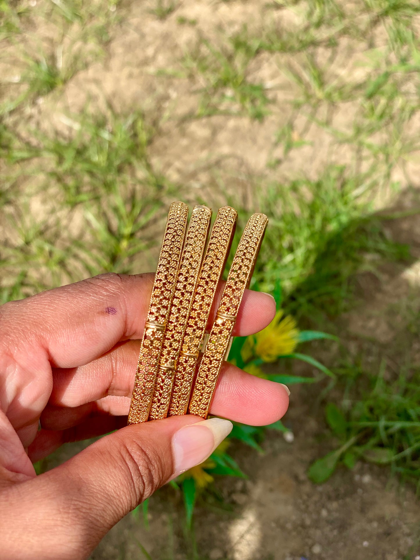 Golden bangles (set of 4) B1