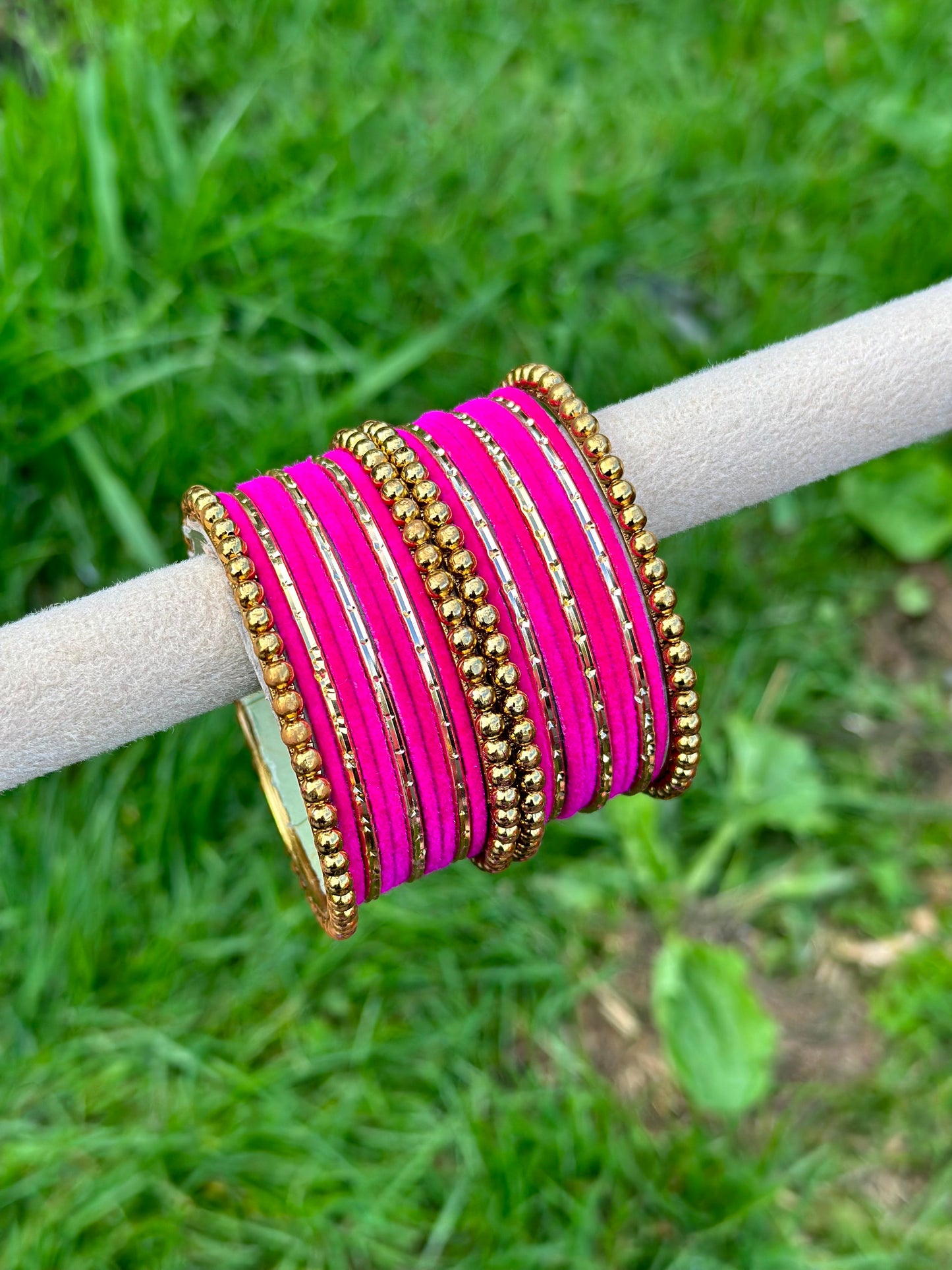 Hot pink velvet bangles set with golden beaded kangan’s