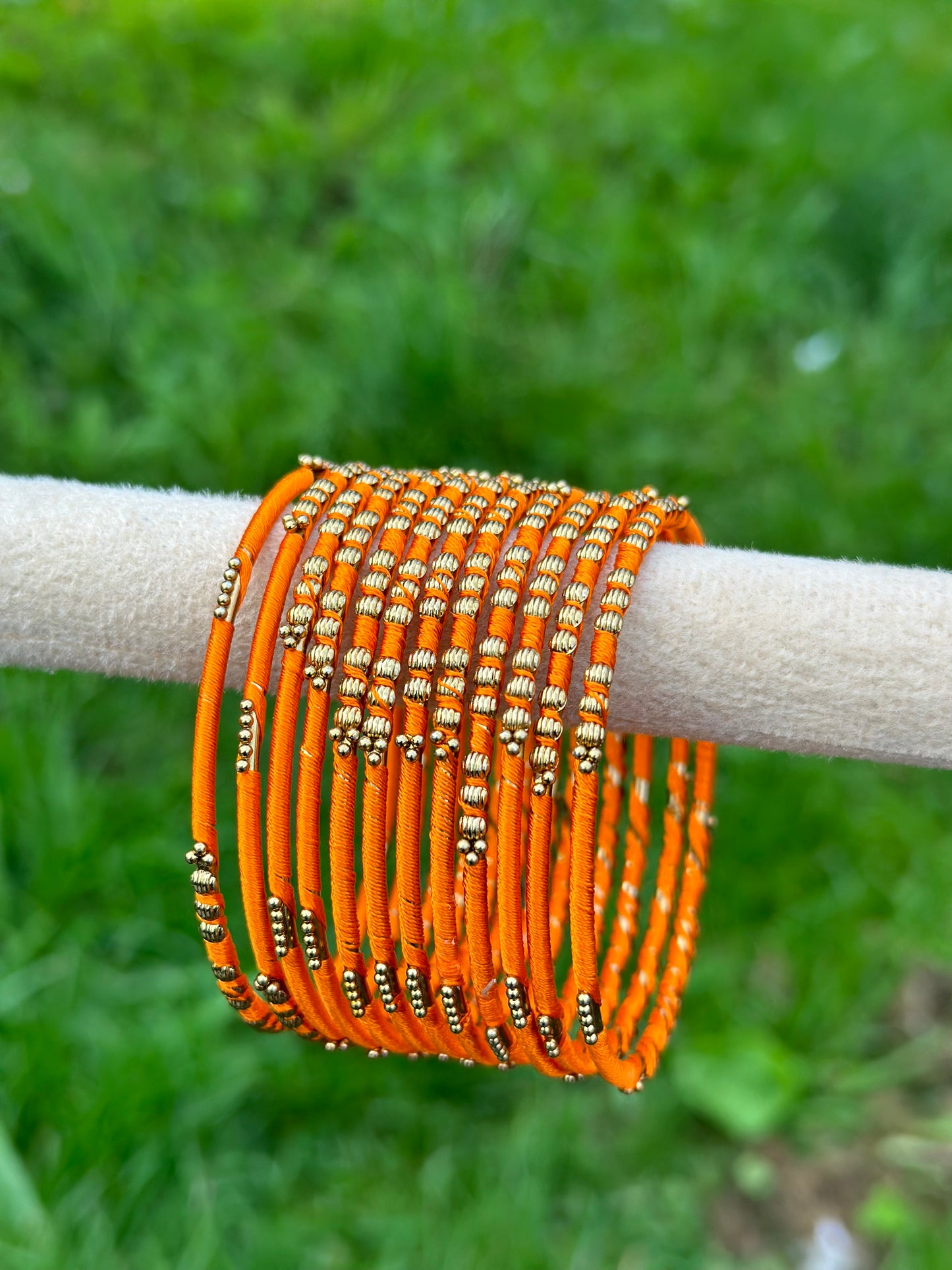 Orange colour thread bangles