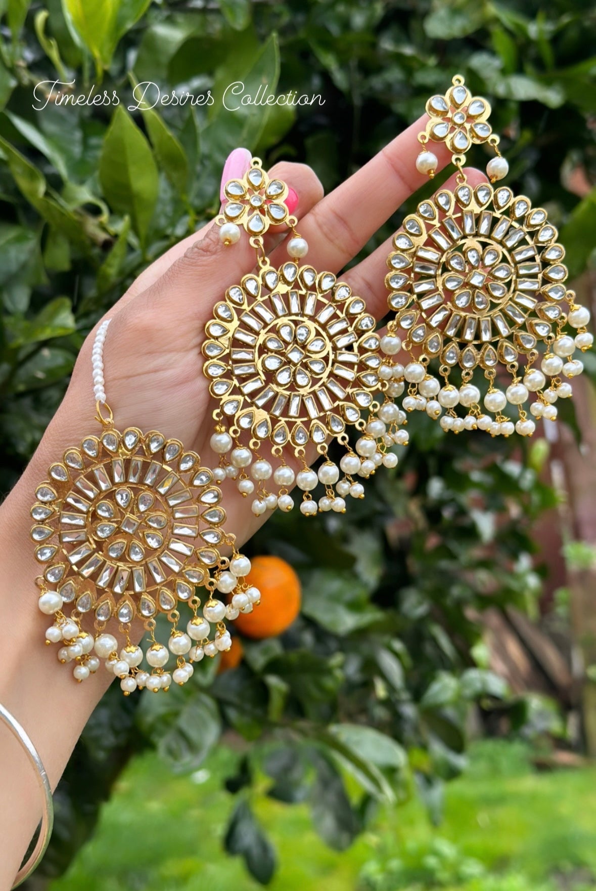 Golden and White earrings and tikka set in Kundan