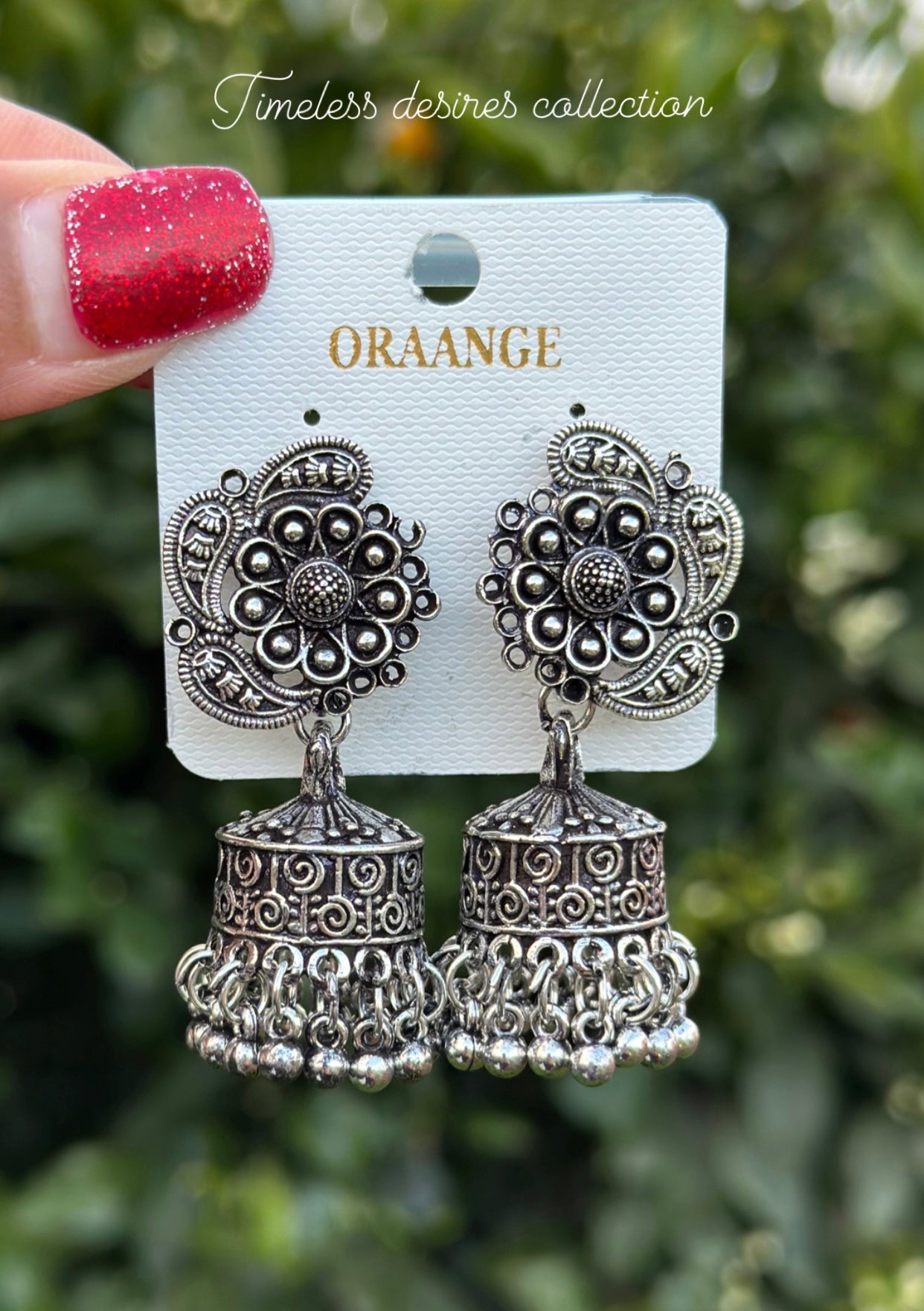 Silver look jhumka earrings in oxidised