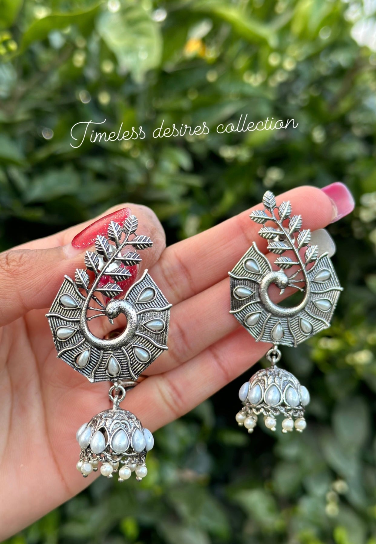 Silver look jhumka earrings in oxidised