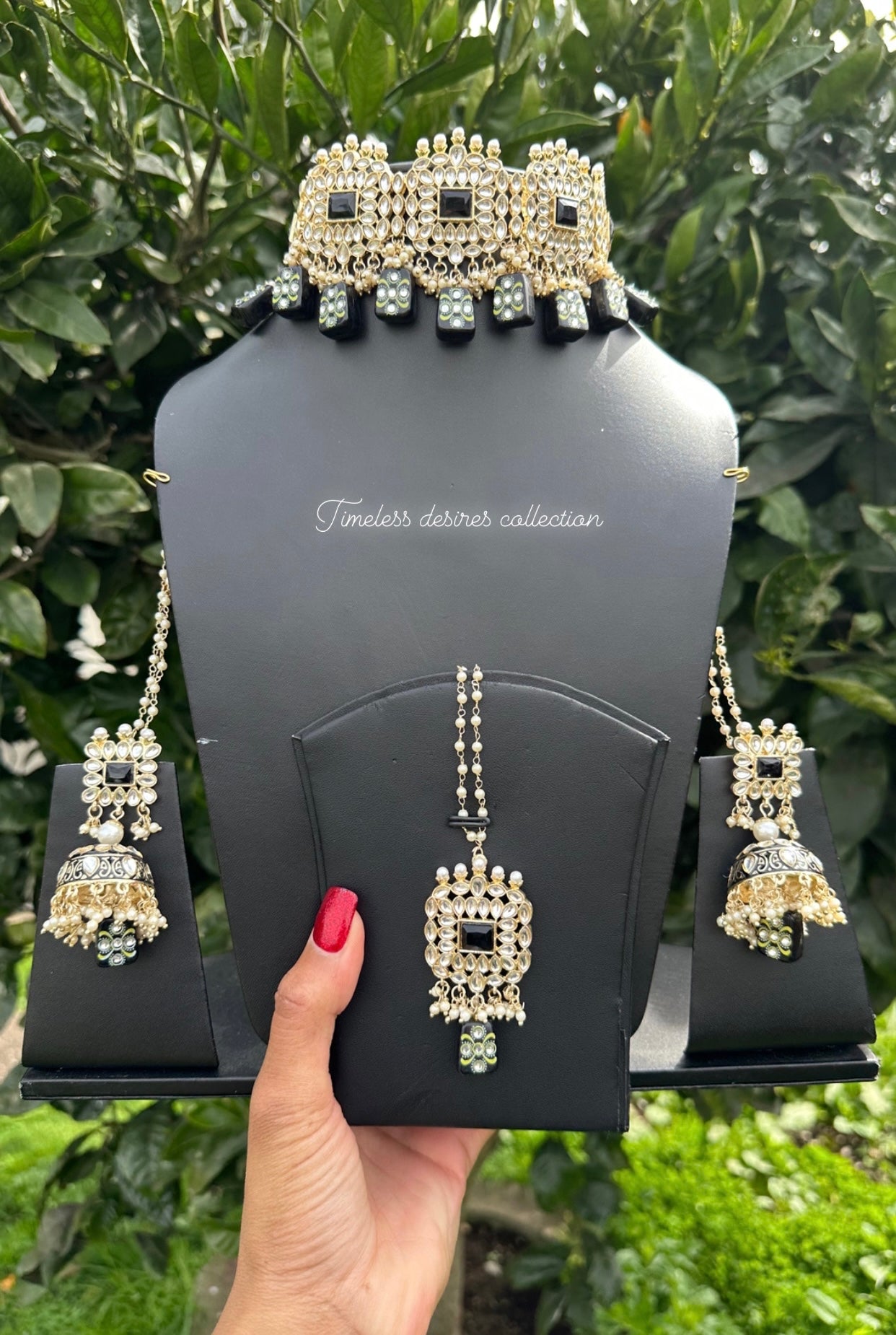 Black choker / necklace set in Kundan with tumbler beads in meenakari with Jhumka included Sahara chains