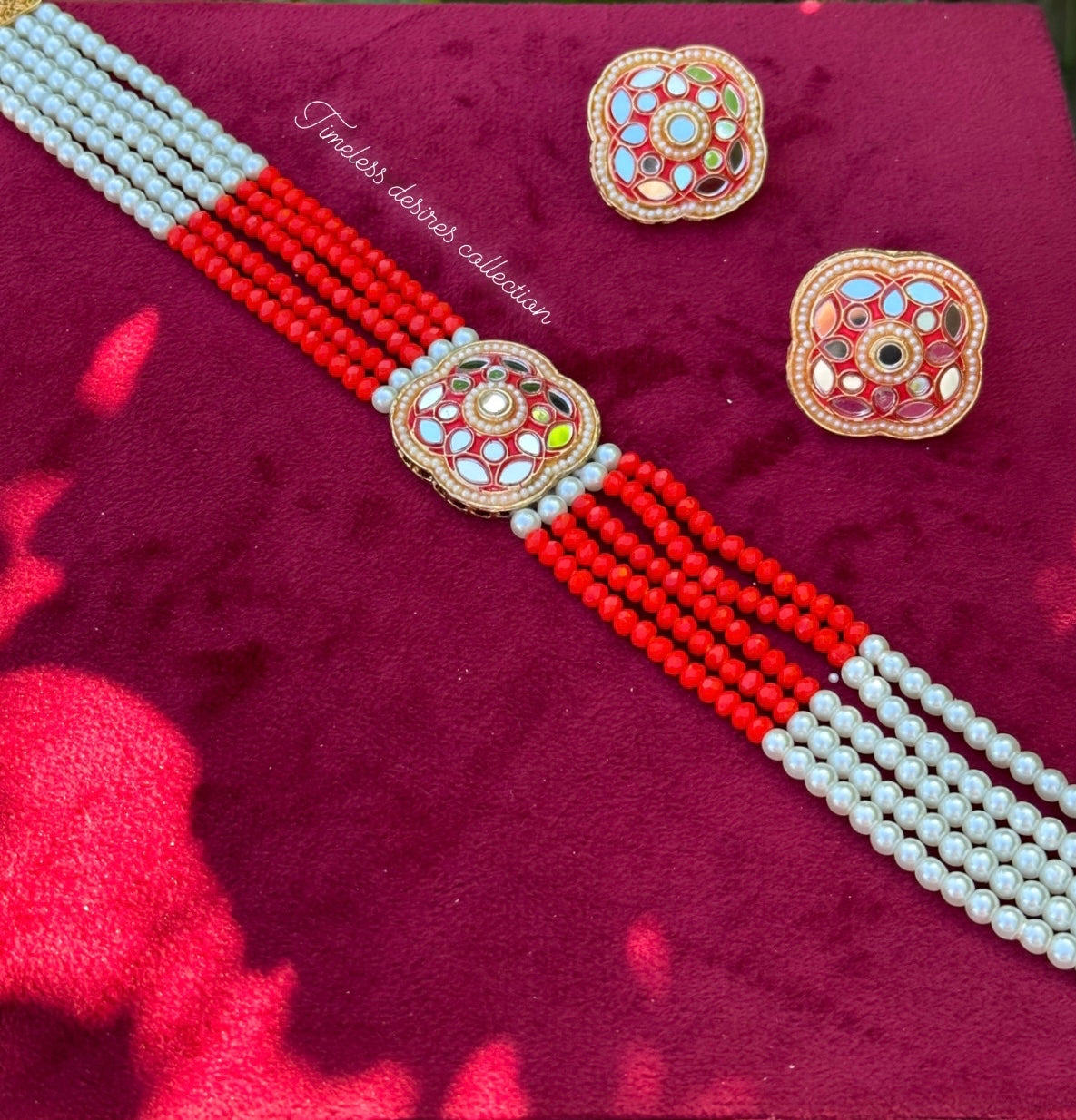 Red choker / necklace set with studs in mirror