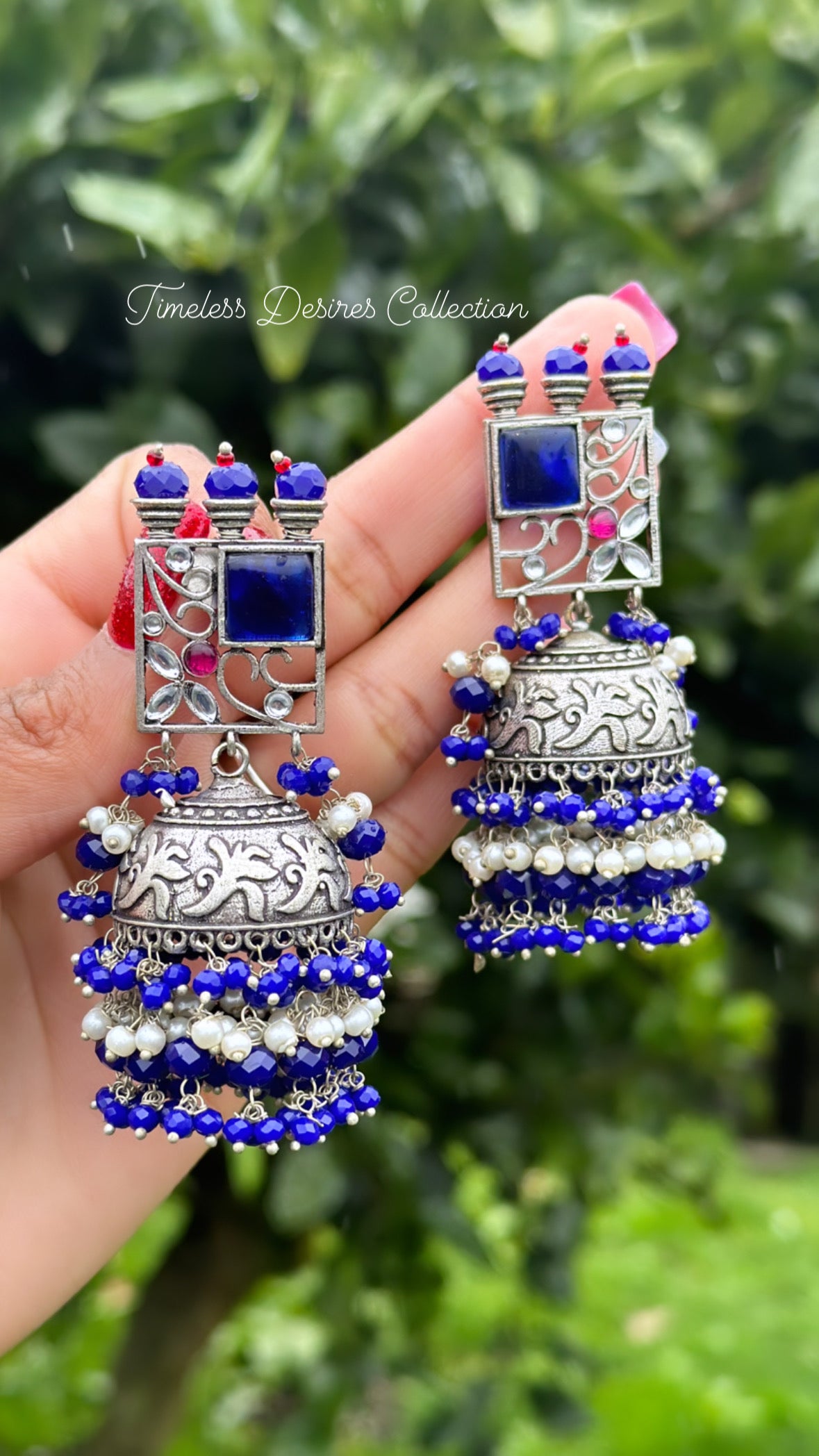 Blue Jhumka drop earrings in silver with Monalisa