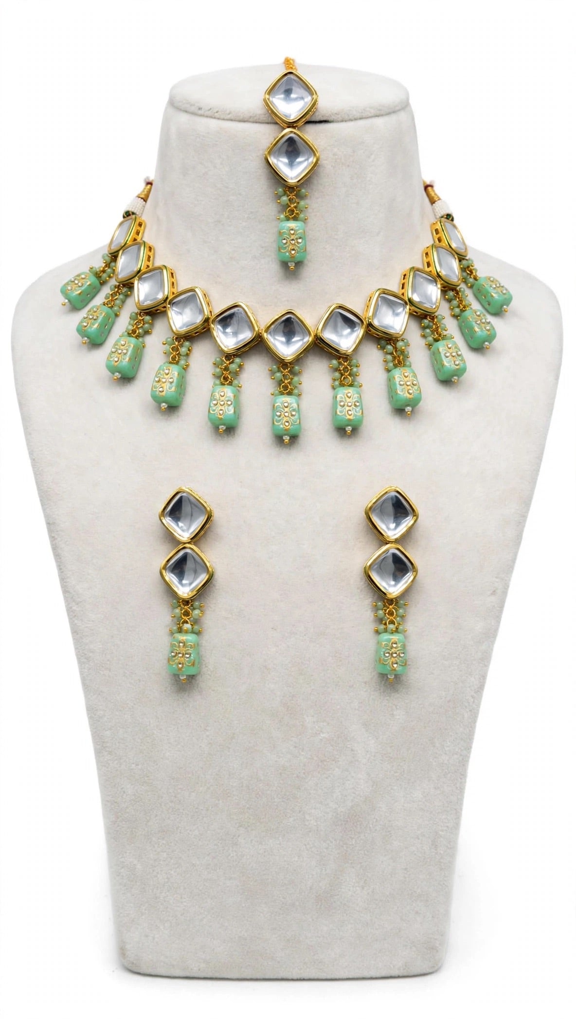 Necklace set with earrings and tikka