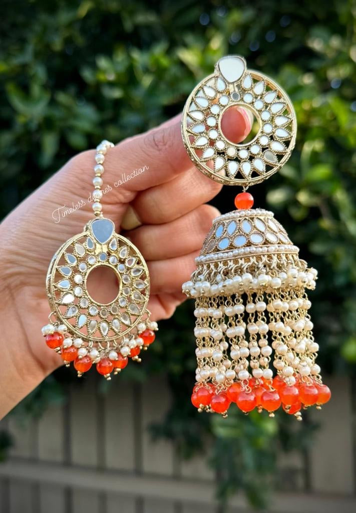 Orange pearl drop Jhumka earrings and tikka set in mirror