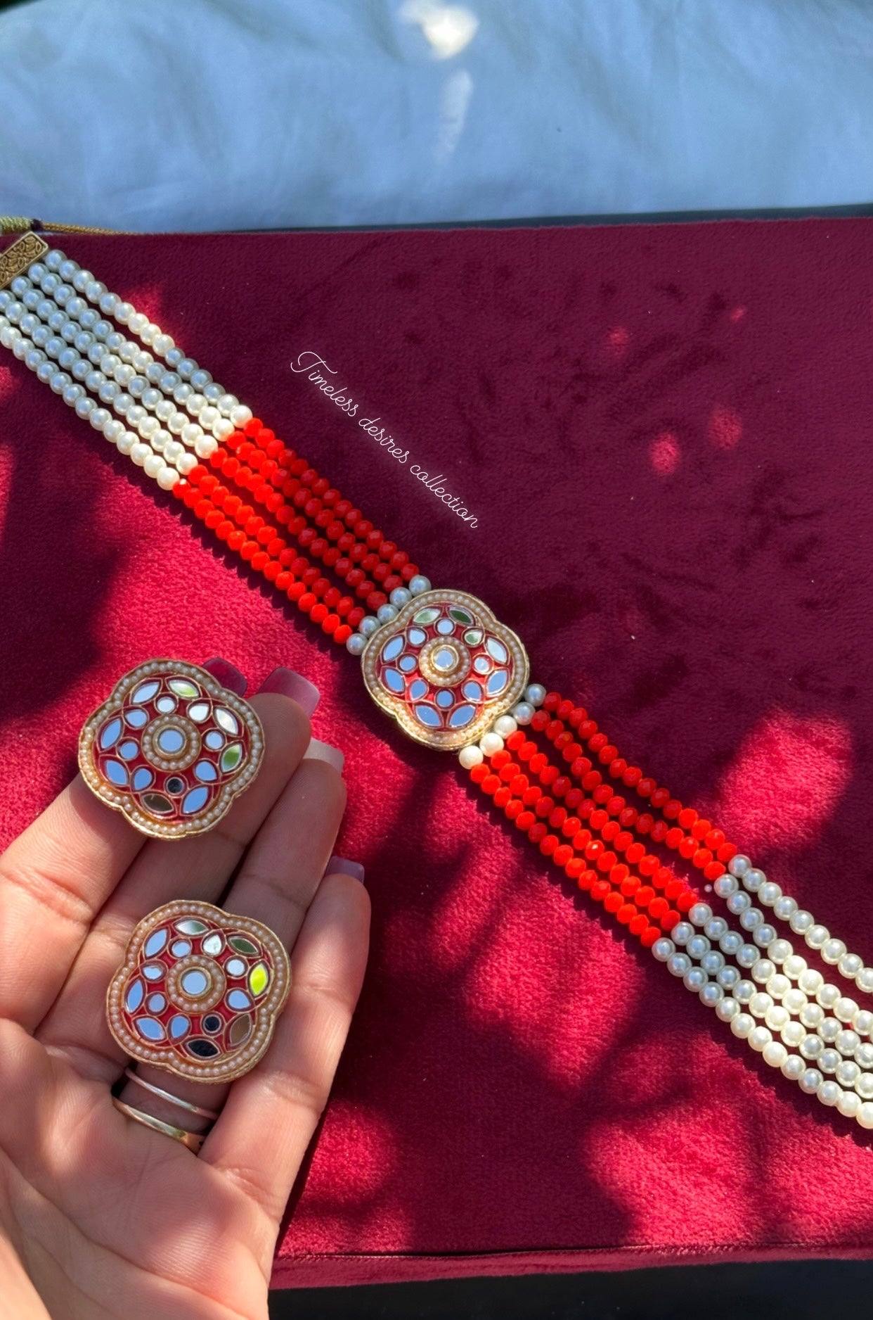 Red choker / necklace set with studs in mirror