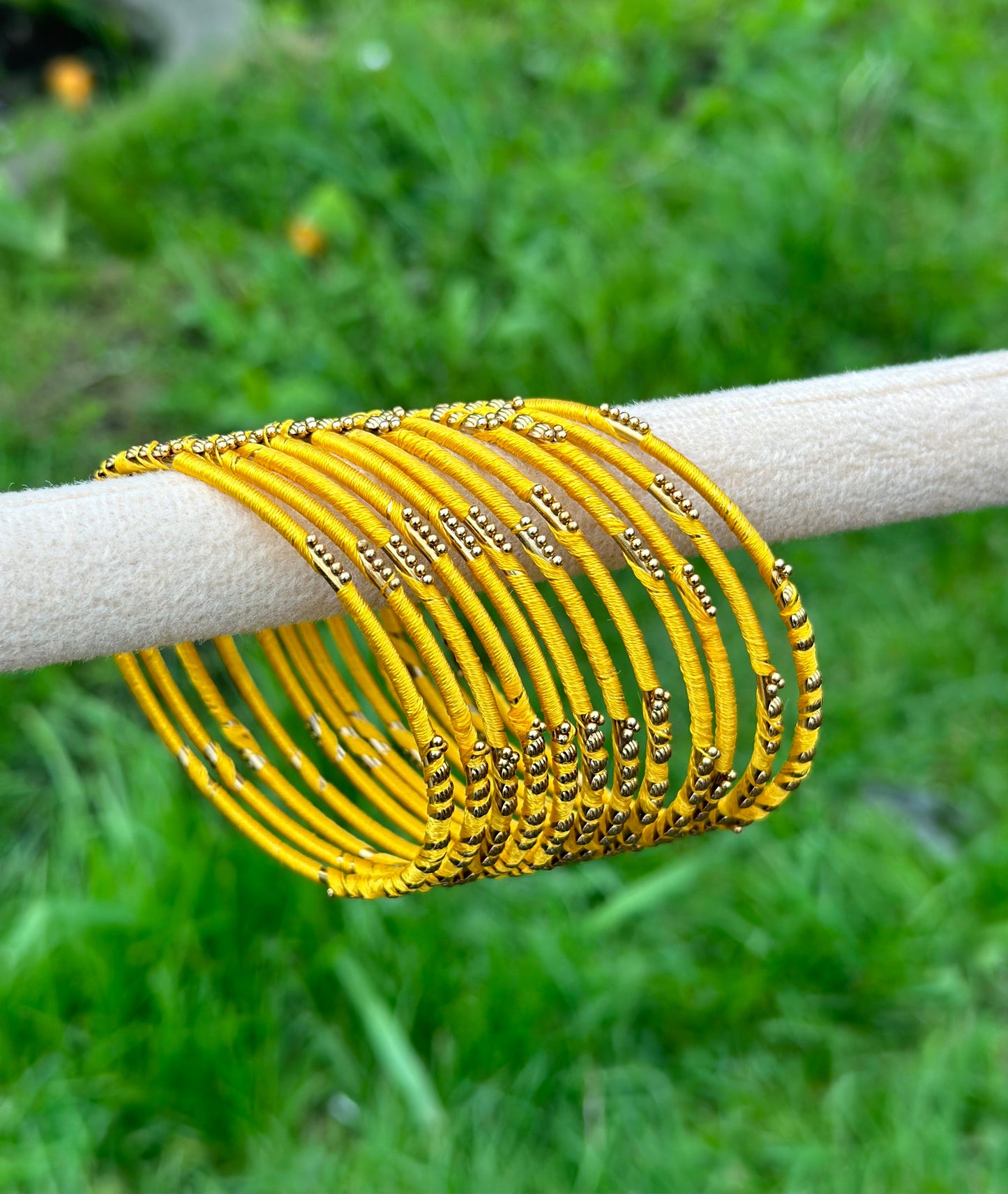 Yellow coloured thread bangles