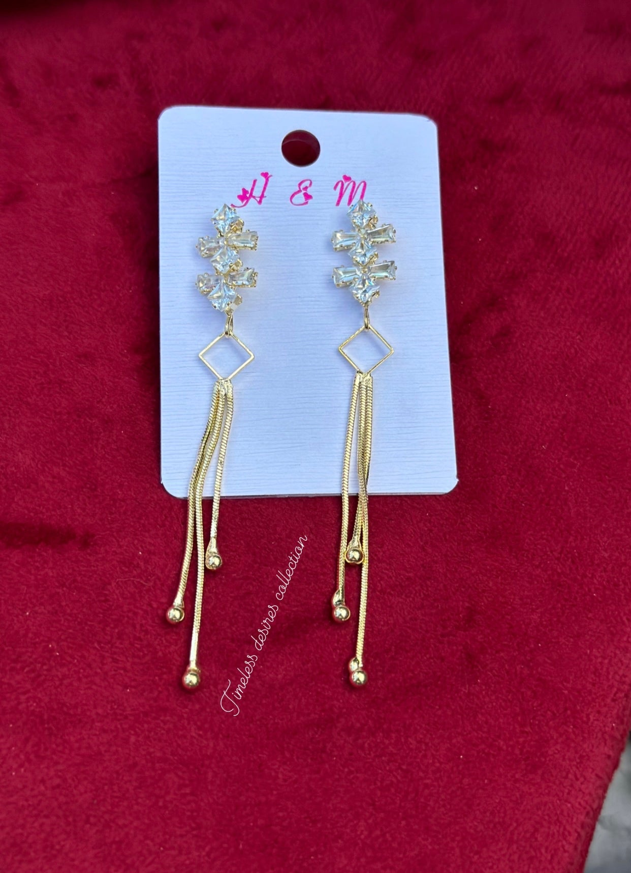 Golden hanging earrings in western style