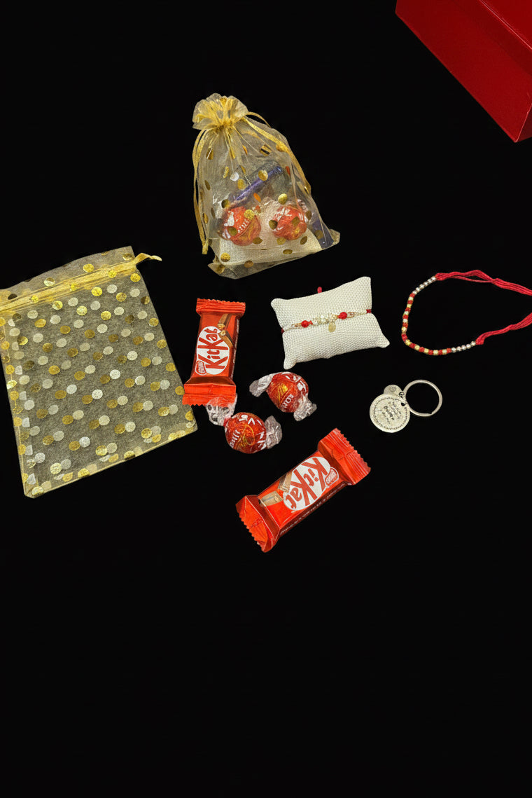 Mini Cute Brother Hamper box - included one premium rakhi , one thread rakhi , 2 Lindor , 2 choco bars , and key chain