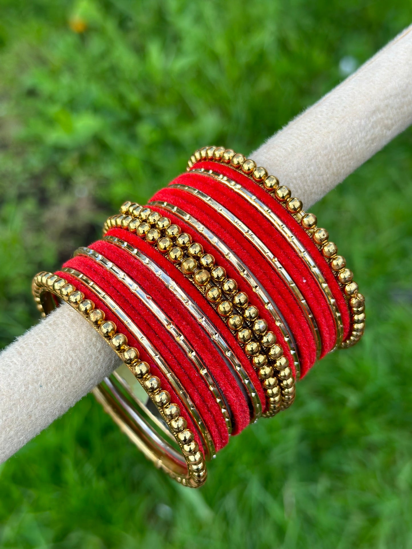 Red velvet bangles set with golden beaded kangan’s
