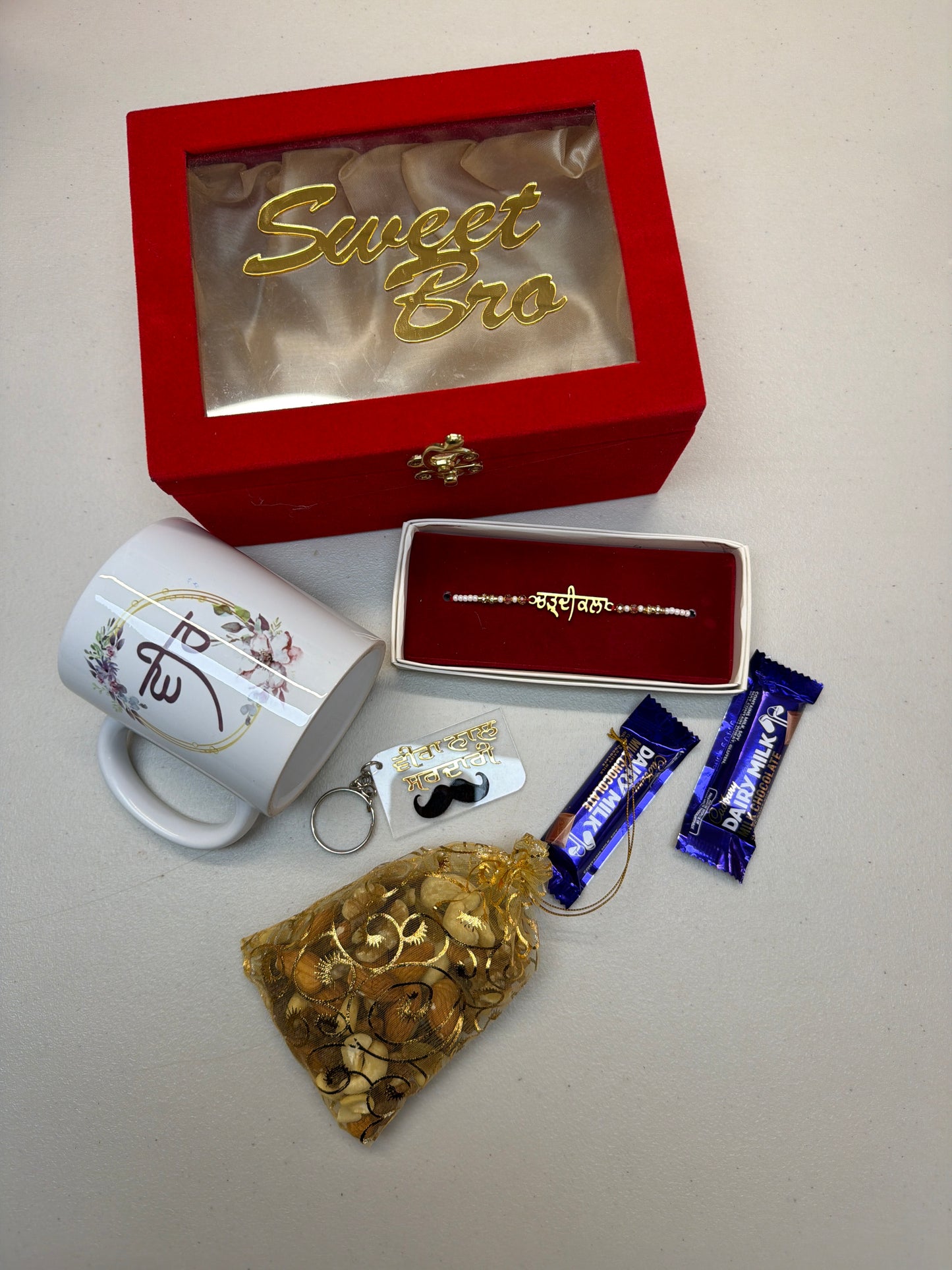 Premium Hamper box - 2 for Brother : includes - hamper box , customsied cup , Key Ring , Rakhdi , Chocolate , Dry fruits
