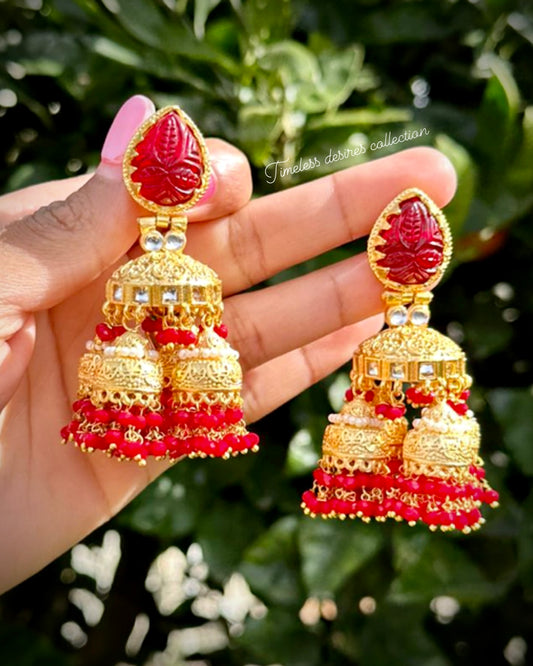 Red Jhumka drop earrings with curving stone in 22 KT gold plating ( high quality )