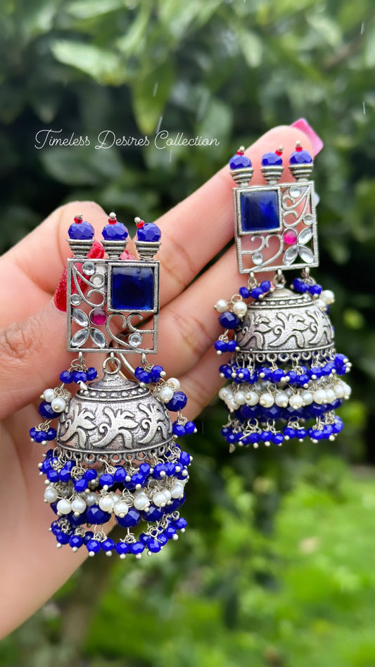 Blue Jhumka drop earrings in silver with Monalisa