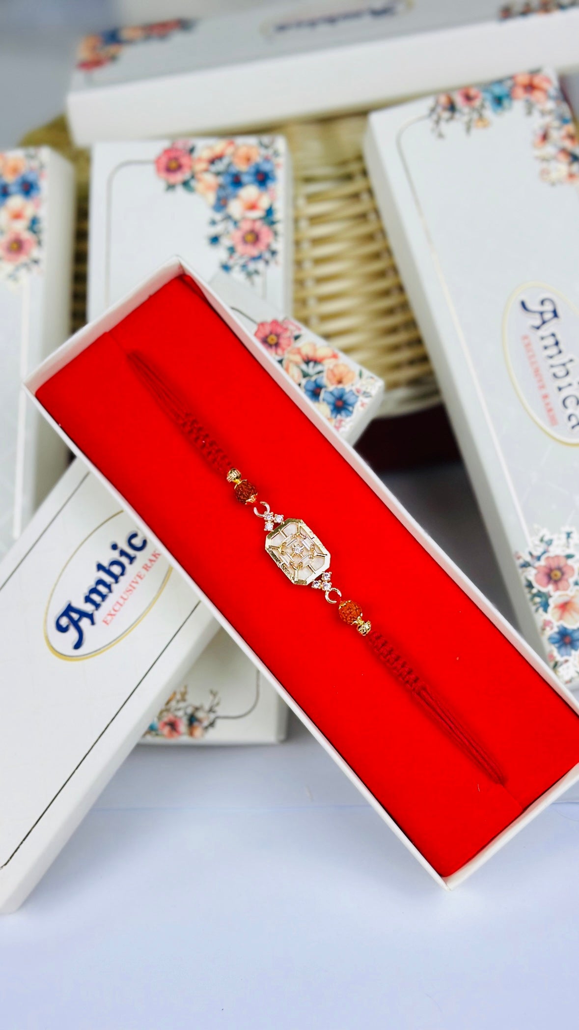 Mother of Pearl with Rudraksh Rakhi / Rakhdi Pack in American Diamond - Code A32
