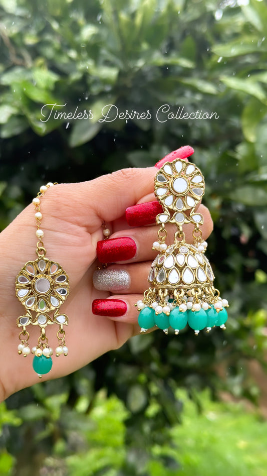 Green Jhumka earrings with tikka in mirror
