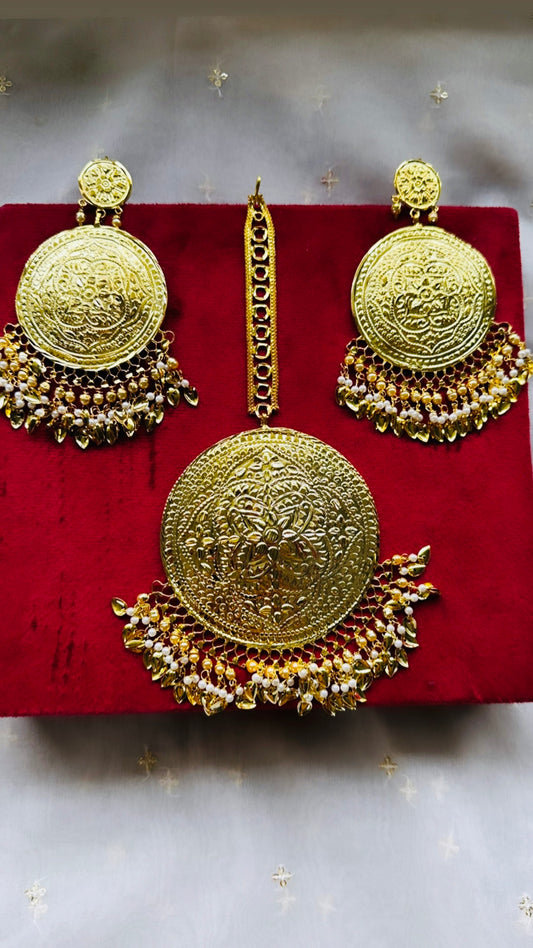 Golden earrings with oversized tikka in Punjabi traditional jewellery