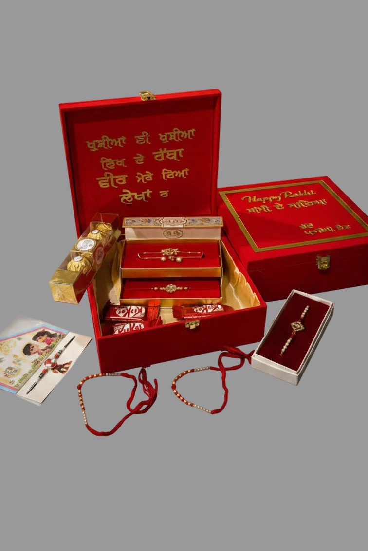 INDIA TO INDIA ONLY ——- Premium family Hamper box - please choose it only if you want it to ship from India - includes premium couple Rakhi box , one anti tarnish or ad Rakhdi , 2 threads , one kids rakhi , chocolates —— assorted designs