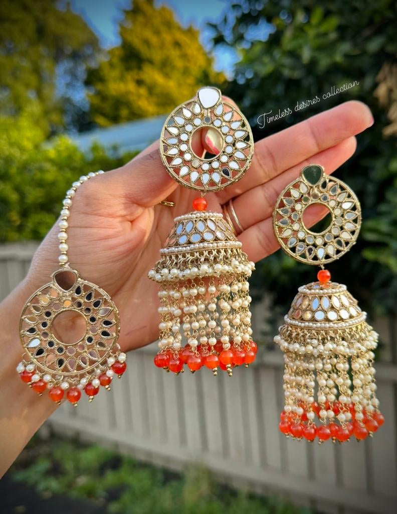Orange pearl drop Jhumka earrings and tikka set in mirror