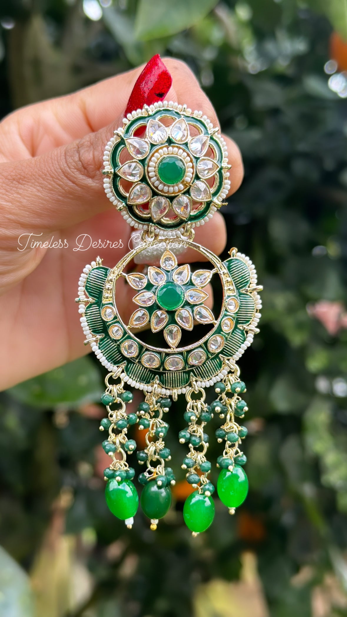 Green pearl loaded earrings in meenakari