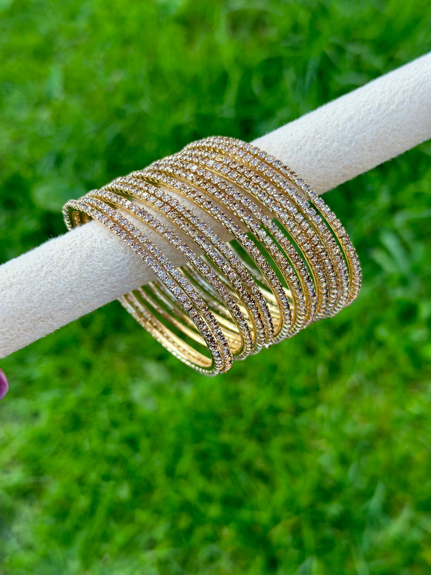 Sleek golden bangles with little diamonds