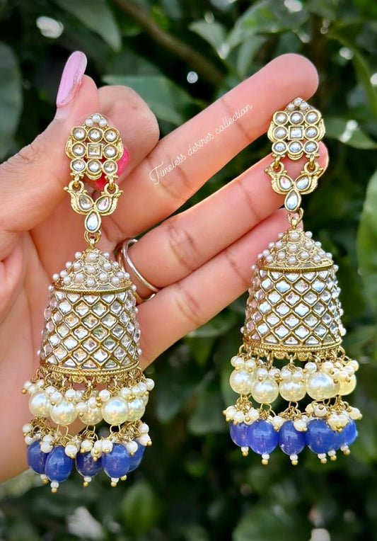 Blue pearl loaded long Jhumka earrings in Kundan