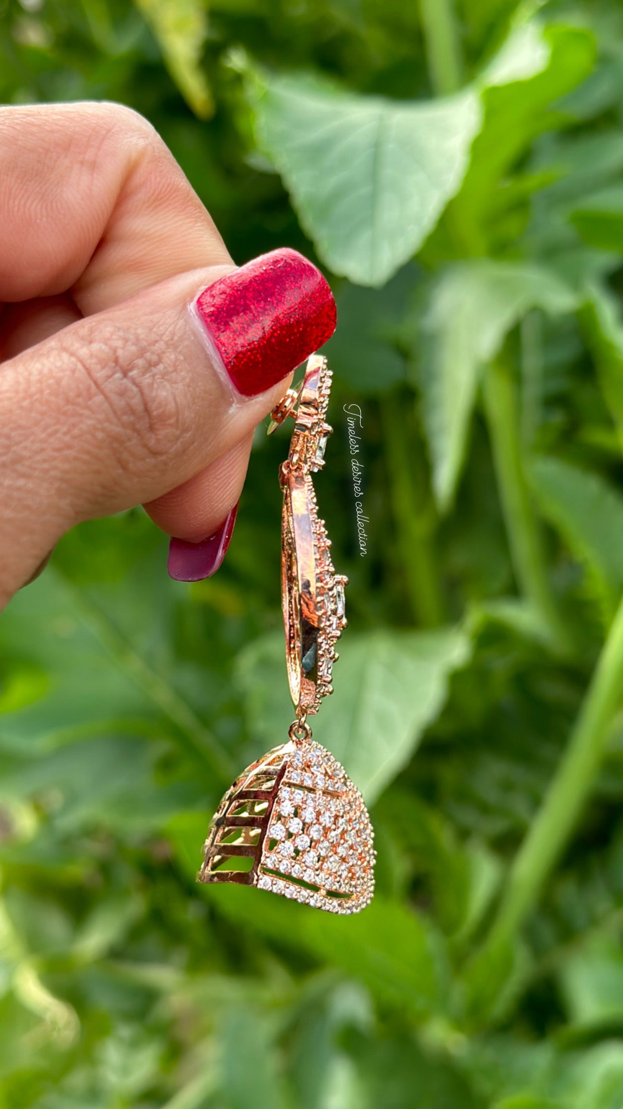 American diamond Jhumka earrings in rose golden polish