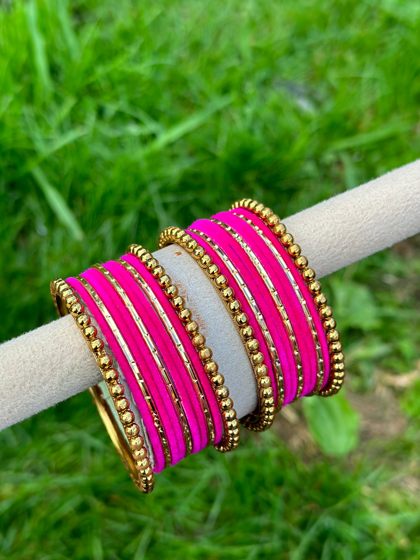 Hot pink velvet bangles set with golden beaded kangan’s