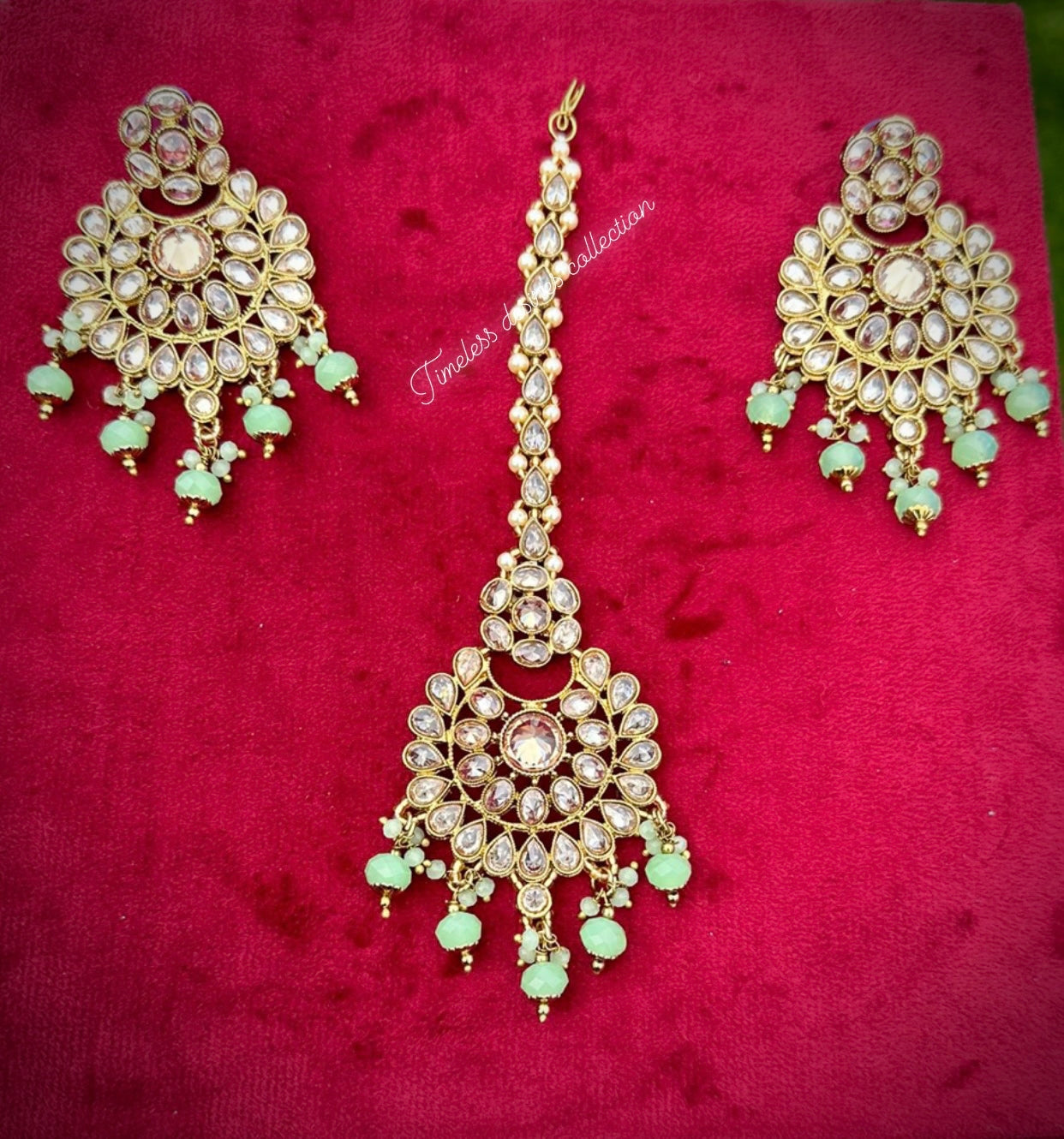 Mint  green earrings and tikka set in reverse AD ( high quality Polki )