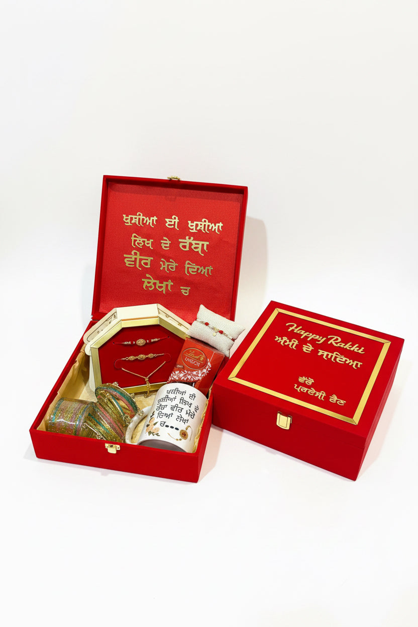 Premium hamper box for family- includes : ( big hamper box , one box Lindor , one customised mug ,  Kashmriri bangles , veera bhabi premium combo , one pillow premium ad rakhi - assorted designs )