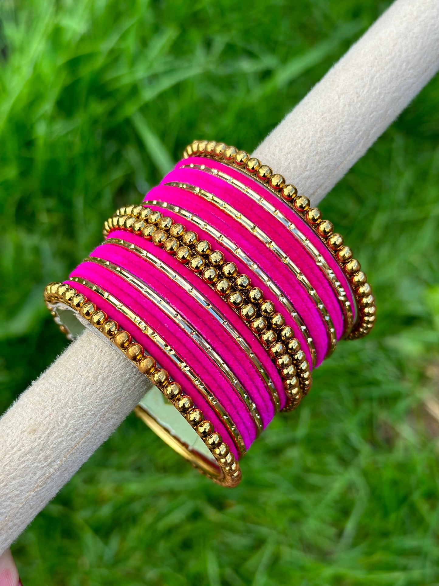 Hot pink velvet bangles set with golden beaded kangan’s
