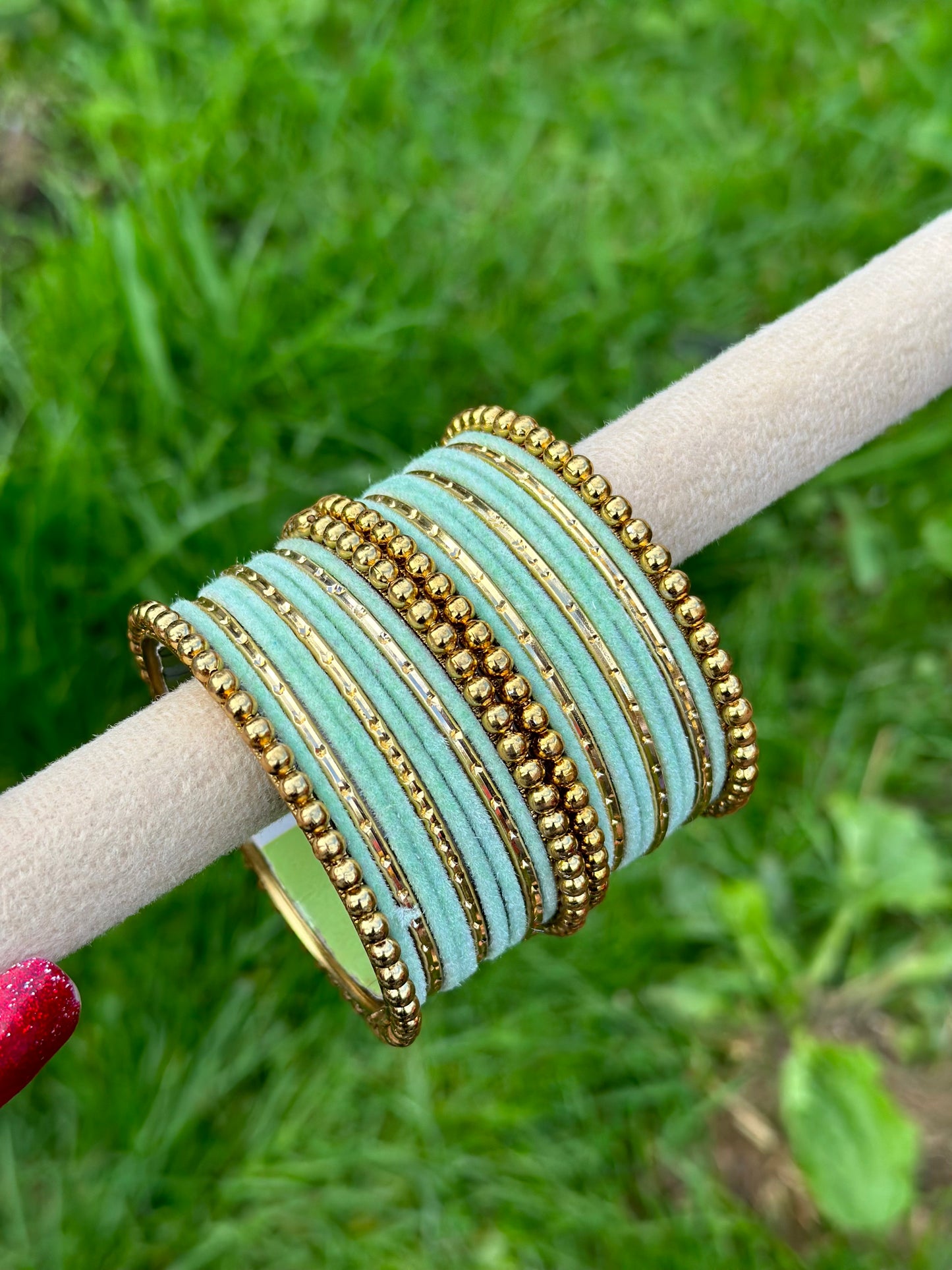 Pista or mint green velvet bangles set with golden beaded kangan’s