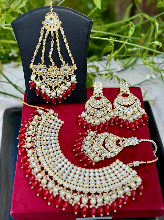 Pearl loaded necklace set with passa in Kundan in red colour