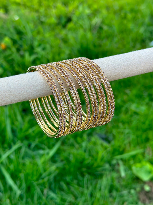 Sleek golden bangles with little diamonds