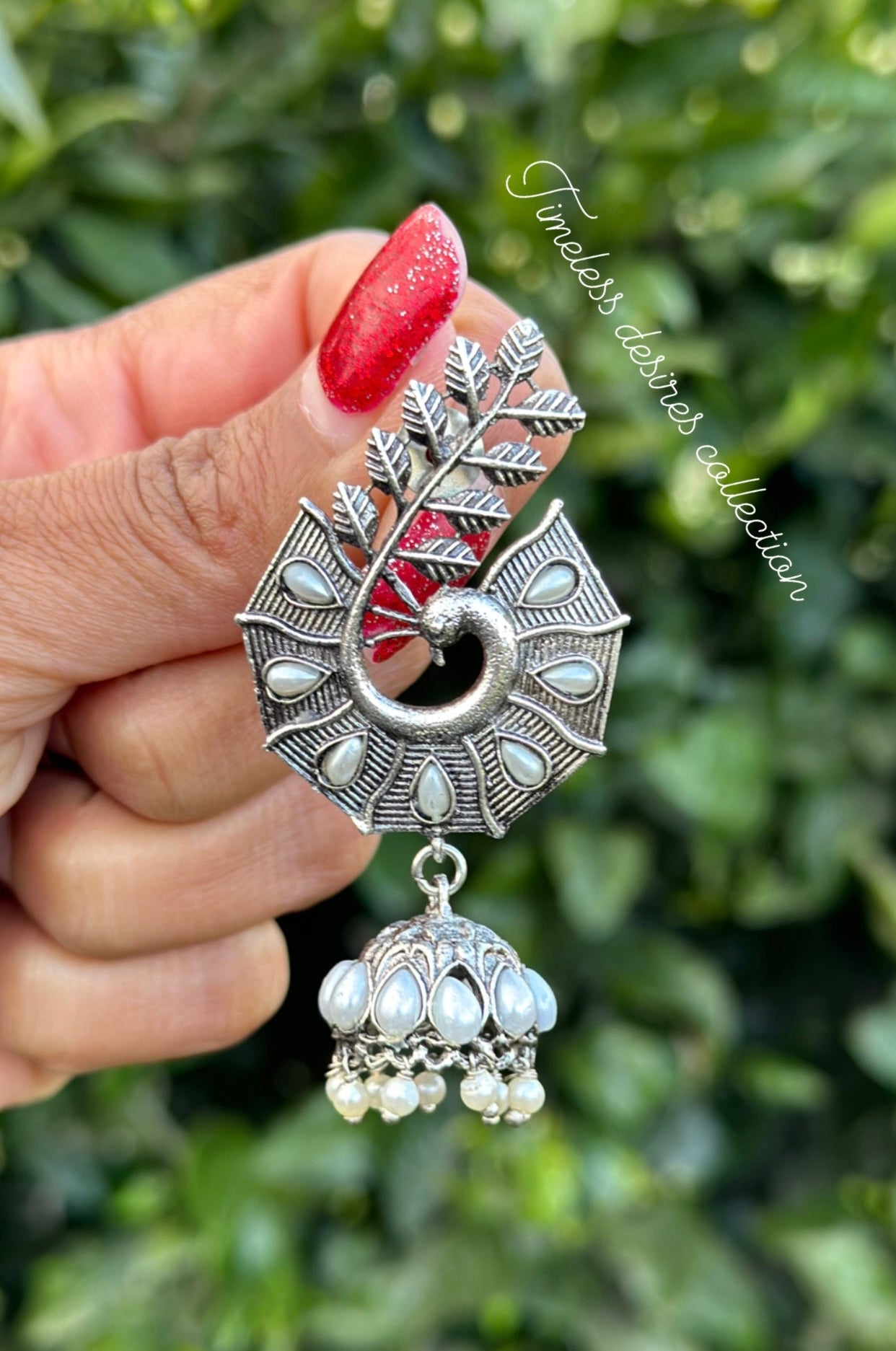 Silver look jhumka earrings in oxidised
