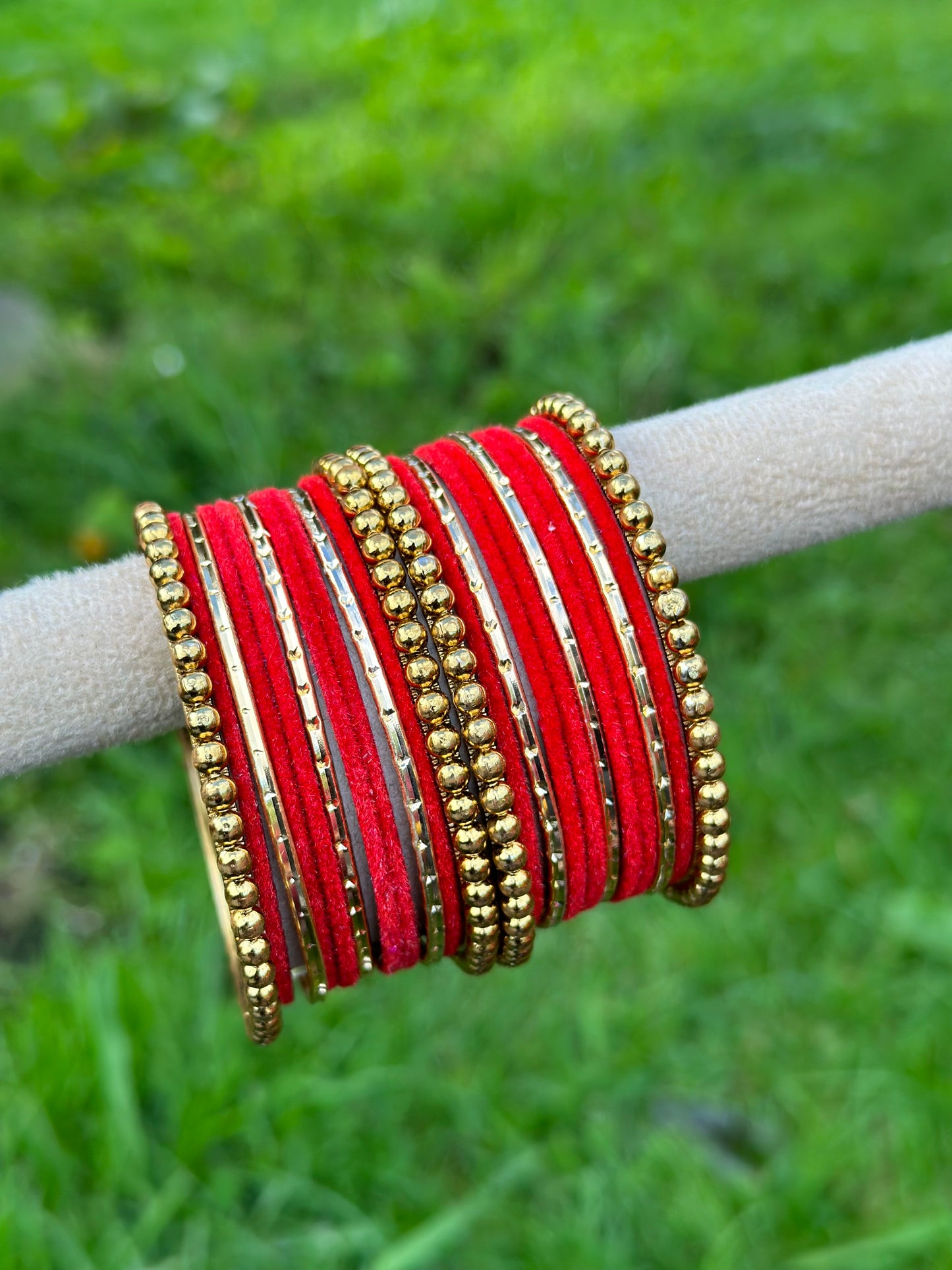 Red velvet bangles set with golden beaded kangan’s