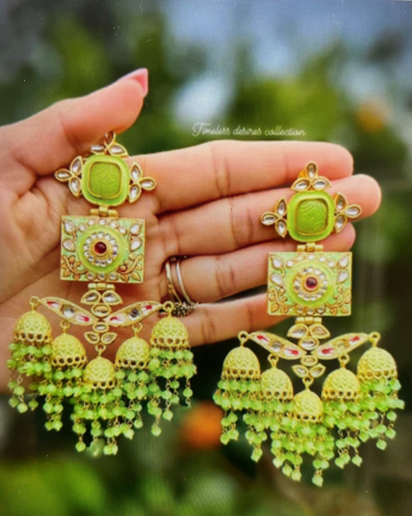( Item code E-1 )Mint green Jhumka earrings in meenakari with 22 KT gold plating
