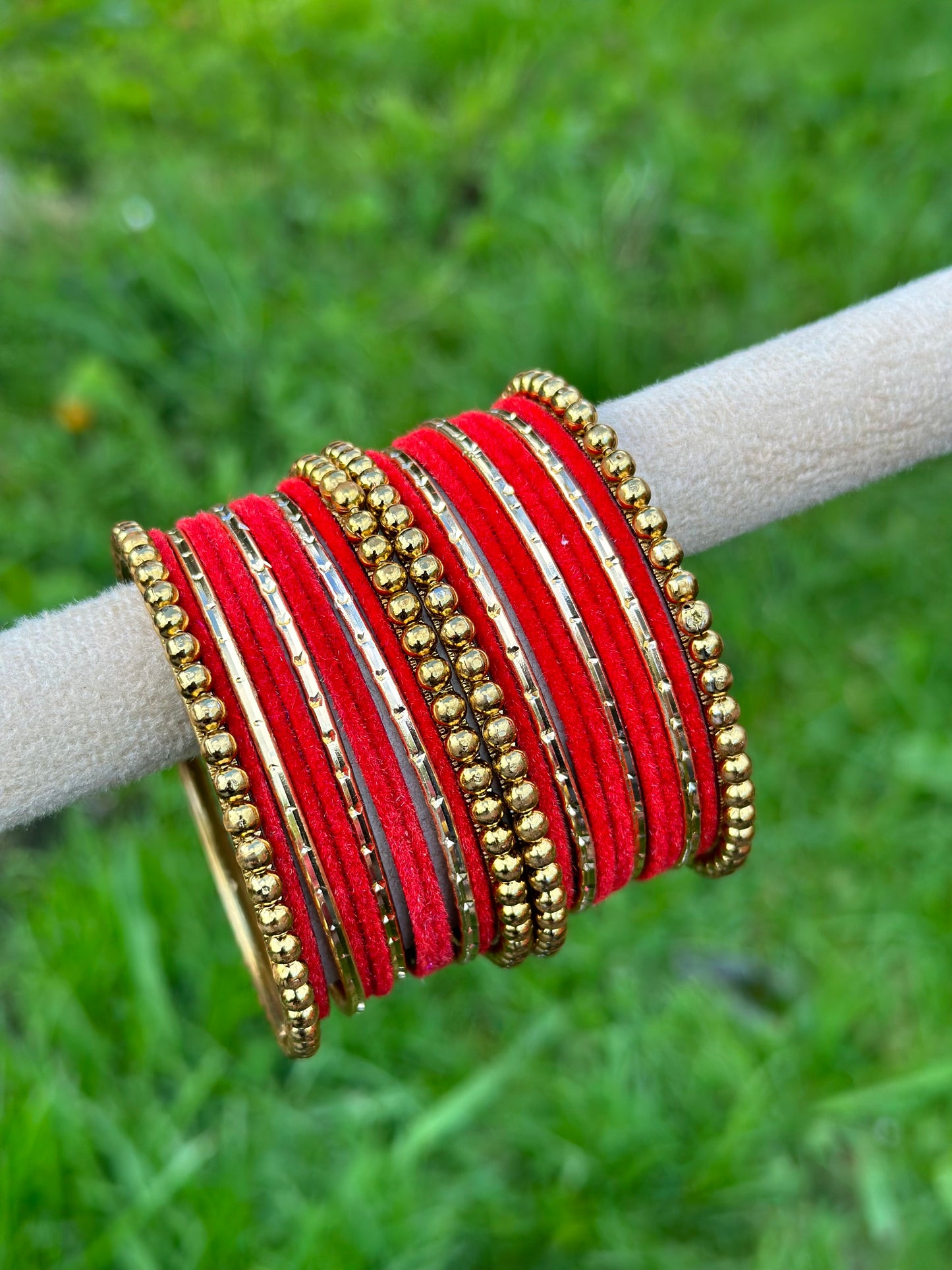 Red velvet bangles set with golden beaded kangan’s