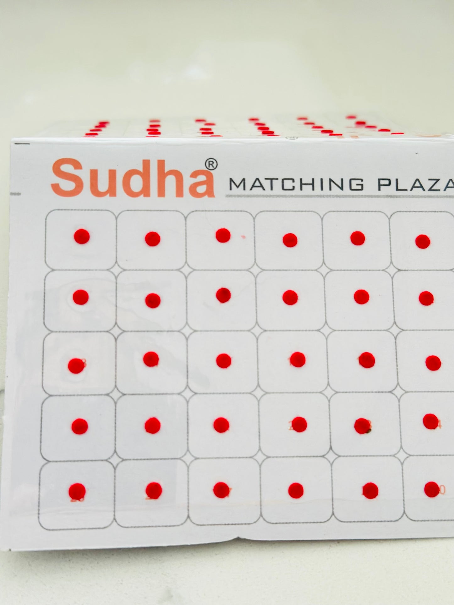 Round shape small bindi card in Red colour